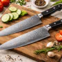Japanese chef knife on a wooden kitchen counter with fresh ingredients and soft natural lighting